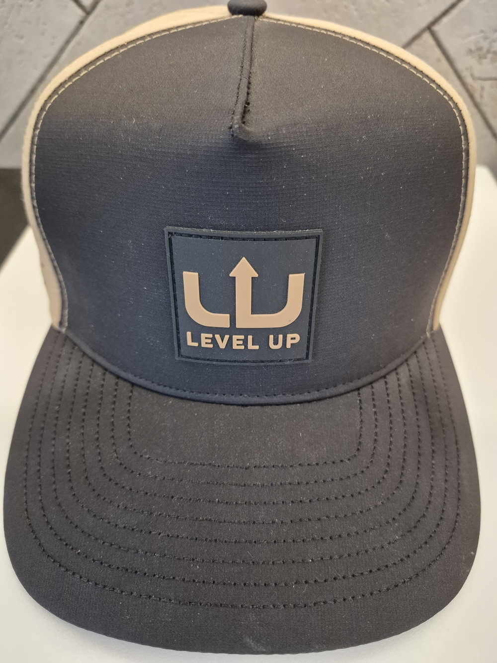 Level Up Men’s Trucker Hat — Black and Tan